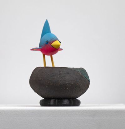 blue bird on black nest with roundels by Chris Barnes
